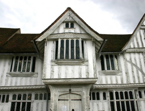 Why do some timber-frame houses have their beams exposed while others don’t?